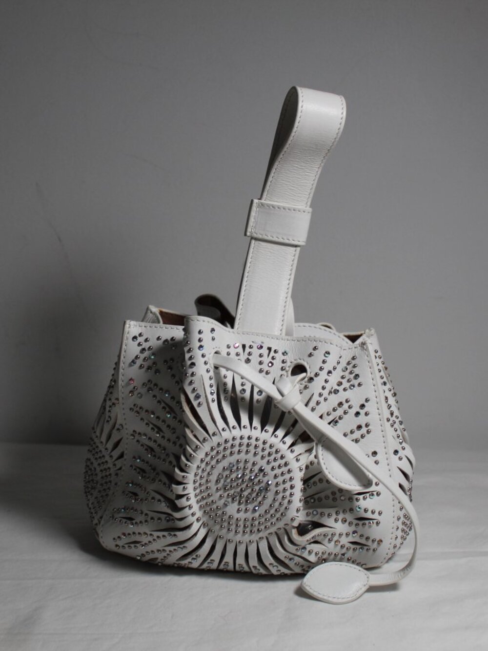 Alaia Alaïa White Rose Marie Handbag Laser Cut Drawstring Bucket Bag w/ Crystal